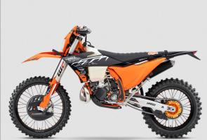 TAKING RESERVATIONS -The 2025 KTM 300 XC-W HARDENDURO is ready to roll out of the racing van and onto the prologue starting line. Based on the already legendary KTM 300 XC-W, the HARDENDURO sets itself apart with an exclusive HARDENDURO parts package. Hardcore protection parts, pull-straps, CNC-machined components - not to mention full-adjustable closed cartridge forks - and a totally unique graphics kit, makes this the ultimate READY TO RACE package for tackling the Worlds toughest offroad championship. ORANGE GLOSSY FRAME - KTM HARDENDURO BAR PAD - FACTORY RACING FRAME PROTECTION SET - FACTORY RACING SEAT - MAP-SELECT SWITCH - FACTORY WHEEL SET - WRAP-AROUND HANDGUARD KIT - RADIATOR FAN - BLACK ANODIZED CNC MACHINED TRIPLE CLAMPS - SKID PLATE - SEMI-FLOATING FRONT BRAKE DISC - FRONT BRAKE DISC GUARD - SOLID REAR BRAKE DISC
REAR BRAKE SAFETY WIRE - ORANGE REAR BRAKE DISC GUARD - ORANGE SUPERSPROX STEALTH REAR SPROCKET - CLUTCH SLAVE CYLINDER PROTECTION - SUPPORTING STRAPS