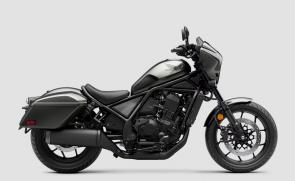 Rebel heart, touring soul.

The Rebel 1100T takes the Rebel 1100s heart and adds the soul of a bagger with hard saddlebags and a sleek front fairing. For 2025, updates include an improved rider position, more comfortable seat, 5-inch TFT display, and Honda RoadSync. Available with optional DCT, it’s the perfect mix of power, comfort, and style.

    1083cc liquid-cooled Unicam® parallel-twin engine
    Programmed Fuel Injection (PGM-FI)
    Wide front and rear tires
    Locking, weather-resistant hard saddlebags
    Handlebar-mounted cowl and windscreen

