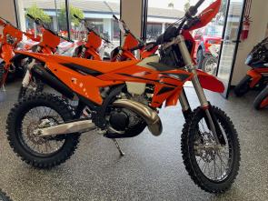 <h2>DEMO UNIT WITH .3 HOURS - Like New</h3>
<h1>2025 KTM 300 XC-W</h1>  
<p>For riders who demand top-tier performance in the toughest off-road conditions, the 2025 KTM 300 XC-W is the ultimate weapon. Born from decades of racing expertise and engineered with cutting-edge technology, this 2-stroke enduro motorcycle is purpose-built to conquer everything from technical trails to wide-open terrain.</p>  

<h2>Unmatched Features for Unstoppable Performance</h2>  

<h3>Next-Level 2-Stroke Engine</h3>  
<ul>
  <li><strong>Fuel-Injected Powerhouse:</strong> The TPI (Transfer Port Injection) system ensures precise fuel delivery, resulting in smooth, efficient, and reliable performance across all elevations and temperatures.</li>
  <li><strong>Optimal Torque & Power Curve:</strong> Effortless low-end grunt and screaming top-end power give you the versatility to dominate technical climbs and wide-open straights.</li>
</ul>  

<h3>Unrivaled Chassis Design</h3>  
<ul>
  <li><strong>Chromoly Steel Frame:</strong> Designed for flex and durability, offering unmatched rider feedback and stability.</li>
  <li><strong>Ultra-Light Subframe:</strong> The advanced polyamide-reinforced aluminum subframe enhances rigidity and reduces overall weight.</li>
</ul>  

<h3>Cutting-Edge Suspension</h3>  
<ul>
  <li><strong>WP XPLOR Forks & Shock:</strong> Fully adjustable suspension for superior control, absorbing impacts and ensuring precise handling on the roughest terrain.</li>
  <li><strong>PDS Rear Shock System:</strong> Eliminates linkage for enhanced ground clearance and reduced maintenance while delivering excellent rear-wheel traction.</li>
</ul>  

<h3>Optimized Ergonomics</h3>  
<ul>
  <li><strong>Slim Bodywork:</strong> Improved rider maneuverability ensures you stay comfortable and in control during long rides.</li>
  <li><strong>Gripper Seat & Updated Graphics:</strong> Stay planted while riding with style.</li>
</ul>  

<h3>Technology That Works for You</h3>  
<ul>
  <li><strong>Map Select Switch:</strong> Customize engine characteristics on-the-fly to adapt to varying terrain and conditions.</li>
  <li><strong>Electric Start:</strong> Quick, hassle-free ignition gets you moving fast, even in challenging conditions.</li>
</ul>  

<h3>Rider-Focused Extras</h3>  
<ul>
  <li><strong>Hydraulic Clutch & Brembo Brakes:</strong> Exceptional braking power and clutch control for precision riding.</li>
  <li><strong>Large Fuel Tank:</strong> A 2.4-gallon tank keeps you on the trail longer without worrying about refueling.</li>
</ul>  

<h2>Why the KTM 300 XC-W Outshines the Competition</h2>  

<h3>Vs. Husqvarna TE 300</h3>  
<p>While the TE 300 shares a similar engine, the KTM 300 XC-W leads with its unique frame geometry and lighter feel, providing unmatched agility.</p>  

<h3>Vs. Beta 300 RR</h3>  
<p>Betas 300 RR offers solid performance, but the KTMs superior suspension and proven TPI system deliver better reliability and rider confidence.</p>  

<h3>Vs. Sherco 300 SE-R</h3>  
<p>Sherco fans may appreciate their models design, but the KTM excels with an electric start, a proven PDS rear shock system, and an extensive dealer network for better support and maintenance.</p>  

<h2>Built for the Bold</h2>  
<p>From high-performance engineering to rider-focused ergonomics, the KTM 300 XC-W is the gold standard for enduro riders. Its lightweight design, cutting-edge features, and exceptional durability make it a true leader in its class.</p>  

<p><strong>Take your riding to the next level with the 2025 KTM 300 XC-W.</strong></p>  